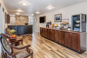 a restaurant with a counter in a room at Travelodge by Wyndham Gananoque in Gananoque