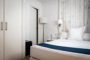 Posteľ alebo postele v izbe v ubytovaní Hotel Medium Sitges Park