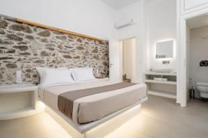 Postel nebo postele na pokoji v ubytování Bee Naxian House