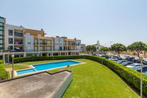 an image of a swimming pool in a parking lot at Apartamento Bela Vista - Minho's Guest in Esposende