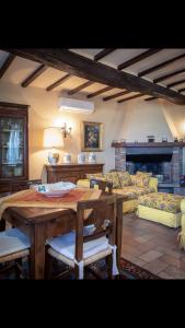 a living room with a table and a couch at Umbrian cottage in Gubbio