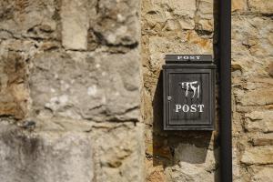 a clock on the side of a stone wall at Creevy Cottages in Rossnowlagh