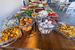 a buffet with many different types of food on a table at Costa Bodrum City in Bodrum City