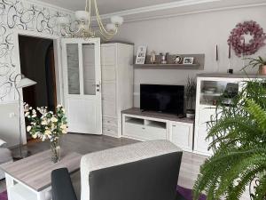 A television and/or entertainment centre at Holiday home in Gyenesdias - Balaton 40755