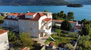 an aerial view of a house on the shore of a lake at Apartment Felix 2 in Ston