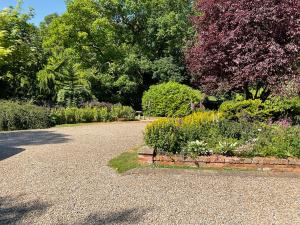 a garden with a stone path and flowers at Fox Hill in Brompton