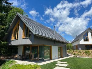 a house with a metal roof at Ambient Resort Bled in Bled