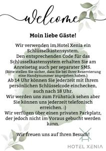 弗倫斯堡的住宿－Hotel Xenia Flensburg，一份欢迎词单,上面有白色背景的鲜花
