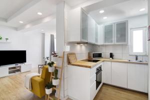 Kuchyň nebo kuchyňský kout v ubytování Moderno e renovado T2