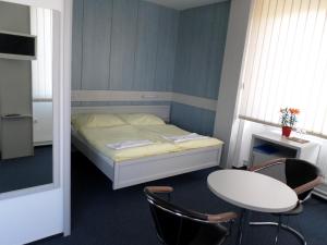 Letto o letti in una camera di Hotel Steiger