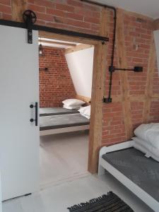 Ένα ή περισσότερα κρεβάτια σε δωμάτιο στο apartament z widokiem na morze +1 φωτογραφίες