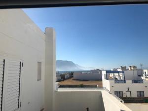 a view from the balcony of a white building at Duplex La Graciosa in Caleta de Sebo
