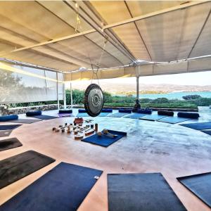 a yoga room with a tire hanging from the ceiling at Glaros Studios Apartments in Antiparos