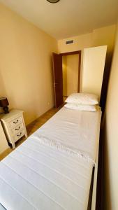 Кровать или кровати в номере Apartamento con vista en L'Hospitalet del Infant