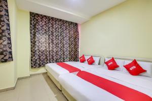 Katil atau katil-katil dalam bilik di Foong Inn Hotel Banting +8 gambar