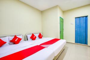 Postel nebo postele na pokoji v ubytování Foong Inn Hotel Banting