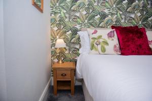 Ένα ή περισσότερα κρεβάτια σε δωμάτιο στο Milton House Studio Apartments Askrigg +76 φωτογραφίες