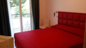 Voodi või voodid majutusasutuse Hotel Matteo toas