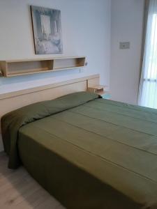 Voodi või voodid majutusasutuse Hotel Matteo toas