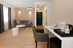 a living room with a couch and a table at Boutique Hotel Villa Telenta in Vela Luka