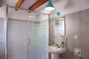 a bathroom with a sink and a shower at Guest House Ibiza in San Antonio
