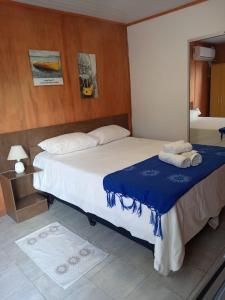 Ένα ή περισσότερα κρεβάτια σε δωμάτιο στο Posada Don Manuel