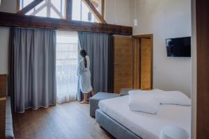 Naturresort PURADIES客房内的一张或多张床位