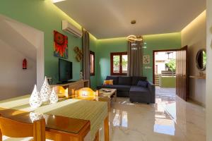 a living room with a couch and a table at Entire vacation house near beach in Gournes