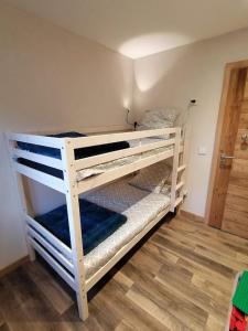 a couple of bunk beds in a room at Chez Léon in Samoëns