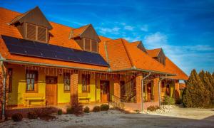 a house with solar panels on the roof at Nosztalgia Vendégház in Zalaegerszeg