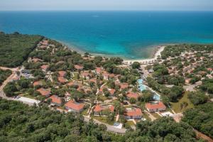 an aerial view of a resort near the ocean at Luxury Glamping Bay Villas Porto Bus in Bale
