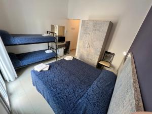 Postel nebo postele na pokoji v ubytování Club Vacanze In