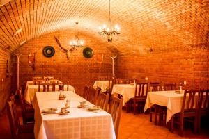 A restaurant or other place to eat at Nosztalgia Vendégház