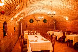 A restaurant or other place to eat at Nosztalgia Vendégház