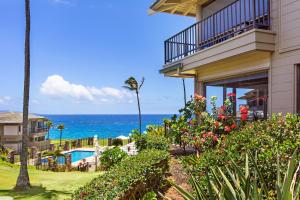 a house with a view of the ocean at Kapalua Bay Villa 24G2 in Honokahua
