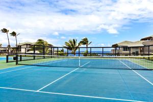 a tennis court in front of a villa at Kapalua Bay Villa 24G2 in Kahana