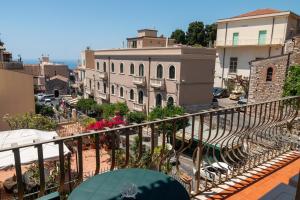 a view of a city from a balcony at Casa vacanze Il vicolo in Taormina