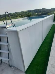 a swimming pool on the roof of a house at Panorama Lomnica in Despotovac