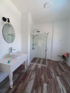 a white bathroom with a sink and a shower at Alaçatı La Vista in Alaçatı +76 photos