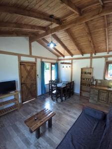 a living room with a couch and a table at Riberas del Azul in Lago Puelo
