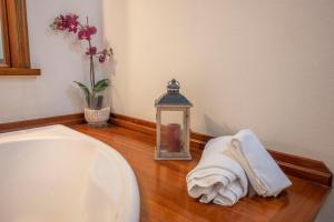 a bathroom with a sink and a lantern and towels at Inappartamento Diamante in Turin +37 photos