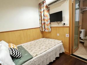 Postelja oz. postelje v sobi nastanitve 利園賓館