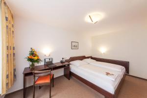 Postel nebo postele na pokoji v ubytování Hotel Strijewski