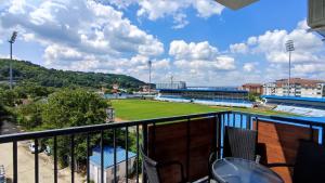 a view of a baseball field from a balcony at Lux Apartman Crnjanski II, Jagodina in Jagodina