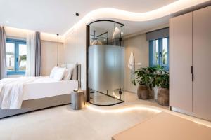 Postel nebo postele na pokoji v ubytování Aura Suites Paros + 37 fotografií