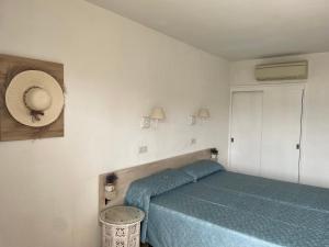 Postel nebo postele na pokoji v ubytování Hostal Roberto