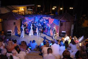 a group of people on a stage with a crowd at Marmaris Park Hotel in Marmaris