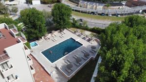 an overhead view of a swimming pool in a building at Hotel St Gregory Park in Rimini