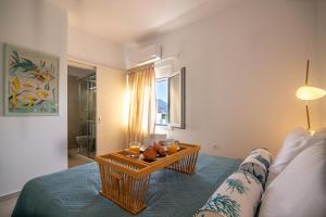 a living room with a table on a bed at Aurelia Sea View Loft Suite in Agios Nikolaos