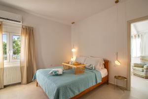 a bedroom with a bed with a table on it at Aurelia Sea View Loft Suite in Agios Nikolaos